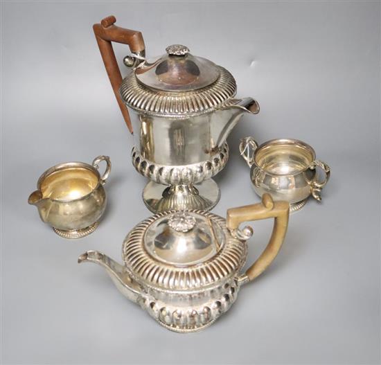 A silver milk jug and sugar bowl and a plated teapot and matching hot water jug,